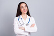 © deagreez - Photo of professional medical worker lady crossed arms look empty space white coat isolated on grey color background