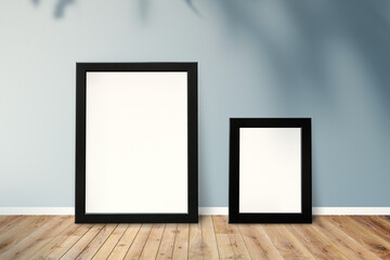 Sticker - Black picture frame mockups leaning against a gray wall