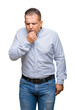 © Krakenimages.com - Middle age arab business man over isolated background feeling unwell and coughing as symptom for cold or bronchitis. Healthcare concept.