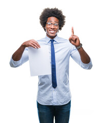 Wall Mural - Afro american man holding blank paper contract over isolated background surprised with an idea or question pointing finger with happy face, number one