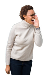 Sticker - Young beautiful african american woman wearing glasses over isolated background shouting and screaming loud to side with hand on mouth. Communication concept.