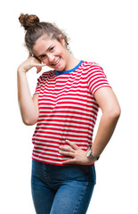 Wall Mural - Beautiful brunette curly hair young girl wearing casual look over isolated background smiling doing phone gesture with hand and fingers like talking on the telephone. Communicating concepts.