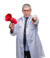 Sticker - Handsome senior doctor man yelling through megaphone over isolated background pointing with finger to the camera and to you, hand sign, positive and confident gesture from the front