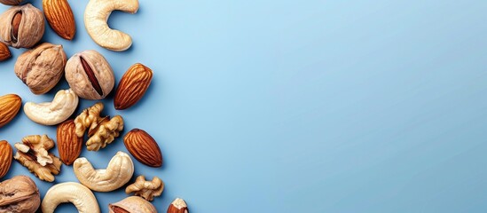 Aufkleber - A variety of tasty nuts on a bright blue backdrop top down view Room for adding text within the copy space image