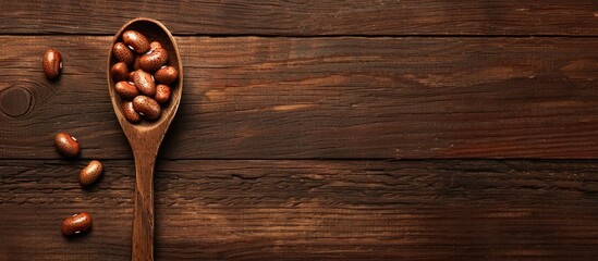 Aufkleber - Copy space image featuring a wooden table with a spoon holding brown beans