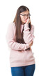 © Krakenimages.com - Young Chinese woman over isolated background wearing glasses looking stressed and nervous with hands on mouth biting nails. Anxiety problem.