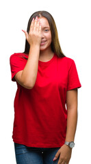 Sticker - Young beautiful caucasian woman over isolated background covering one eye with hand with confident smile on face and surprise emotion.