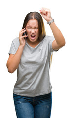 Young beautiful caucasian woman talking on smartphone over isolated background annoyed and frustrated shouting with anger, crazy and yelling with raised hand, anger concept