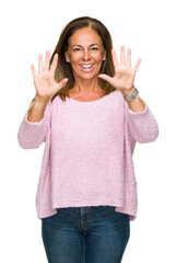 Poster - Beautiful middle age adult woman wearing winter sweater over isolated background showing and pointing up with fingers number ten while smiling confident and happy.