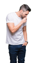 Canvas Print - Young man wearing casual white t-shirt over isolated background feeling unwell and coughing as symptom for cold or bronchitis. Healthcare concept.