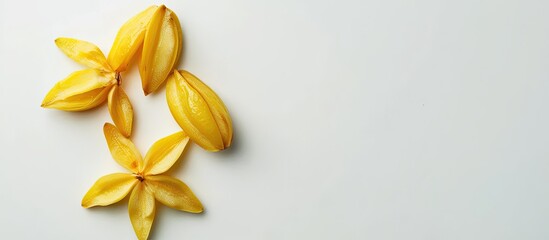 Wall Mural - Top view arrangement featuring sliced carambola on a white backdrop with room for text in the copy space image