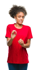 Poster - Young afro american woman over isolated background disgusted expression, displeased and fearful doing disgust face because aversion reaction. With hands raised. Annoying concept.