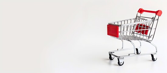 Wall Mural - Isolated shopping cart on a white background with copy space image