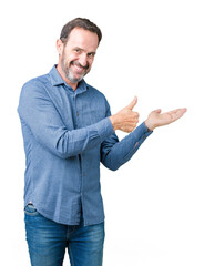 Poster - Handsome middle age elegant senior man over isolated background Showing palm hand and doing ok gesture with thumbs up, smiling happy and cheerful