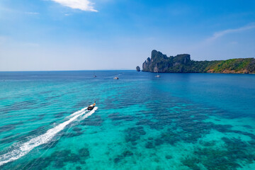 Wall Mural - longtail boat turquoise clear water in Phi Phi, Krabi Thailand. Amazing travel landscape photo in Thai