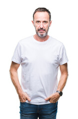 Middle age hoary senior man wearing white t-shirt over isolated background with serious expression on face. Simple and natural looking at the camera.