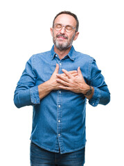 Sticker - Middle age hoary senior man wearing glasses over isolated background smiling with hands on chest with closed eyes and grateful gesture on face. Health concept.