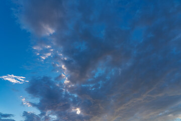 Wall Mural - white fluffy clouds standing out against a black background