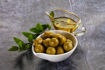 Ripe tasty green olives with branch