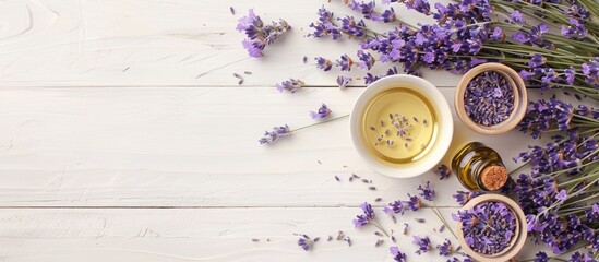 Poster - A variety of lavender items including flowers dried blooms and fragrant oil displayed on a white wooden surface with a designated copy space image