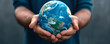 © PTC_KICKCAT - Close-up of hands holding a globe, symbolizing global unity in climate advocacy efforts