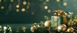 © Ilgun - A joyful Christmas and New Year arrangement featuring a golden gift box and shimmering gold ornaments on a green backdrop with room for your designs. Copy space image