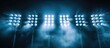 © Ilgun - Soccer stadium lights shining with reflection on a black background creating a copy space image