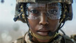 © Frank Gärtner - Close up portrait of a serious female soldier wearing digital glasses with AI generated information is preparing for a military operation