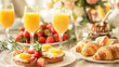 © bvbflo1 - Brunch setup with eggs benedict mimosas and croissants
