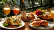 © bvbflo1 - Brunch setup with eggs benedict mimosas and croissants