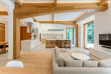 Poster - modern interior with big wooden arch seperating kitchen and lioving room 