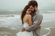 © InfiniteStudio - Romantic couple embraced on beach in love concept