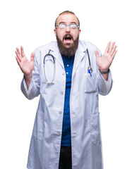 Wall Mural - Young caucasian doctor man wearing medical white coat over isolated background celebrating crazy and amazed for success with arms raised and open eyes screaming excited. Winner concept