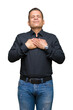 © Krakenimages.com - Handsome middle age arab business man over isolated background smiling with hands on chest with closed eyes and grateful gesture on face. Health concept.