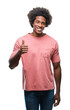 © Krakenimages.com - Afro american man over isolated background doing happy thumbs up gesture with hand. Approving expression looking at the camera with showing success.