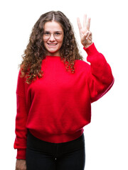 Canvas Print - Beautiful brunette curly hair young girl wearing glasses and winter sweater over isolated background showing and pointing up with fingers number three while smiling confident and happy.