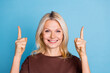 © deagreez - Photo of lovely gorgeous woman wear trendy brown clothes presenting empty space isolated on blue color background