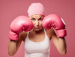 © Andrej - a woman wearing boxing gloves