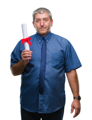 Canvas Print - Handsome senior man holding degree over isolated background with a confident expression on smart face thinking serious