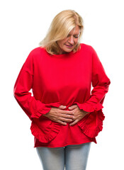 Wall Mural - Middle age blonde woman over isolated background with hand on stomach because indigestion, painful illness feeling unwell. Ache concept.