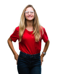 Wall Mural - Young beautiful blonde woman wearing glasses over isolated background with a happy and cool smile on face. Lucky person.