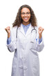 © Krakenimages.com - Young hispanic doctor woman screaming proud and celebrating victory and success very excited, cheering emotion