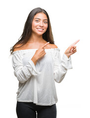 Wall Mural - Young beautiful arab woman over isolated background smiling and looking at the camera pointing with two hands and fingers to the side.