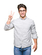 © Krakenimages.com - Young handsome man wearing glasses over isolated background showing and pointing up with fingers number two while smiling confident and happy.