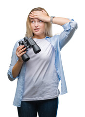 Sticker - Young caucasian woman holding binoculars over isolated background stressed with hand on head, shocked with shame and surprise face, angry and frustrated. Fear and upset for mistake.