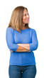 © Krakenimages.com - Middle age beautiful woman wearing winter sweater over isolated background smiling looking to the side with arms crossed convinced and confident