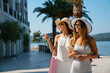 © NDABCREATIVITY - Luxurious life for two women walking and shopping on summer vacation. People travel fun concept.