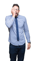 Wall Mural - Young business man wearing glasses over isolated background Yawning tired covering half face, eye and mouth with hand. Face hurts in pain.