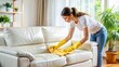 © Spot Decor - Woman Cleaning White Leather Sofa with Yellow Gloves, Cleaning, Home, Furniture, Living Room, Cleaning Supplies. , Cleaning
