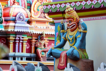 Wall Mural - Indian God Nrsimhadeva sits in lotus position on a temple in Trivandrum, India.